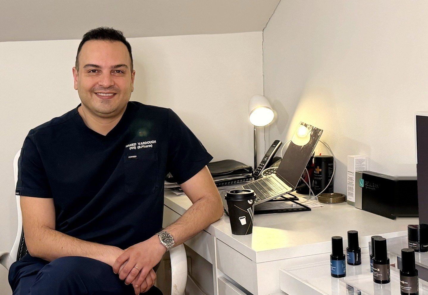 Hamed Vardough, cosmetic nurse, at his desk in the Diamond Aesthetics clinic in Parramatta